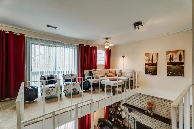 a bathroom with a toilet a sink and a window