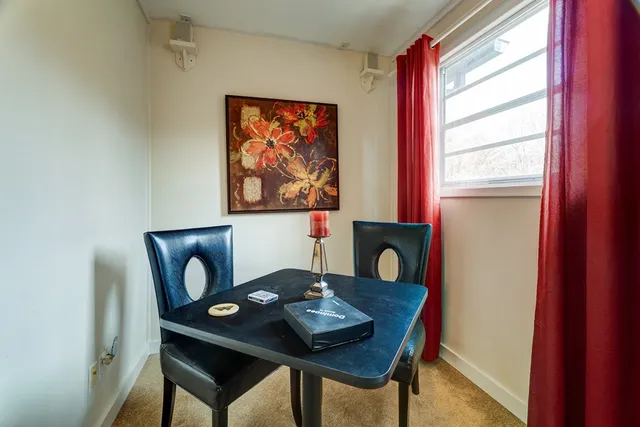 a bedroom with a bed and wall painting