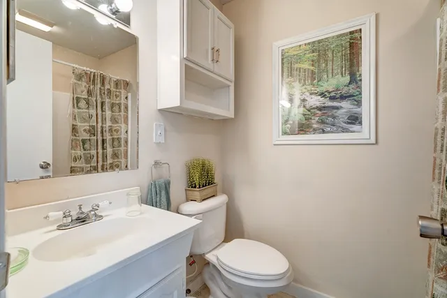 a view of a wooden deck and a backyard