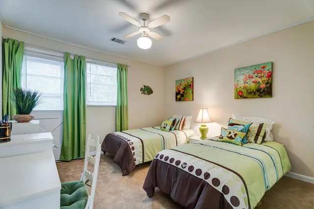 a bedroom with a bed and window