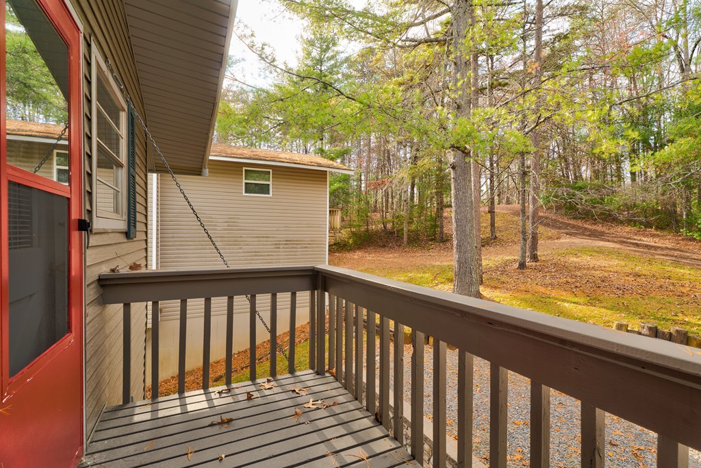 96 Clubhouse Court Ellijay, GA 30536 - Photo 48 of 56 a view of a small deck with wooden floor and fence
