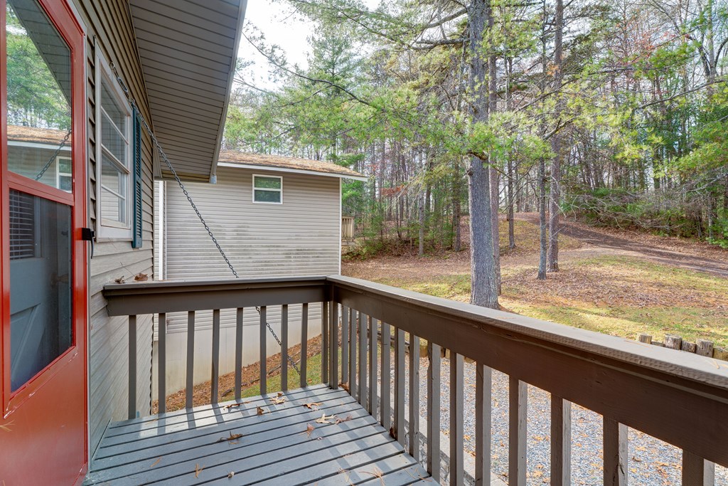 96 Clubhouse Court Ellijay, GA 30536 - Photo 49 of 56 a view of a wooden deck and a backyard