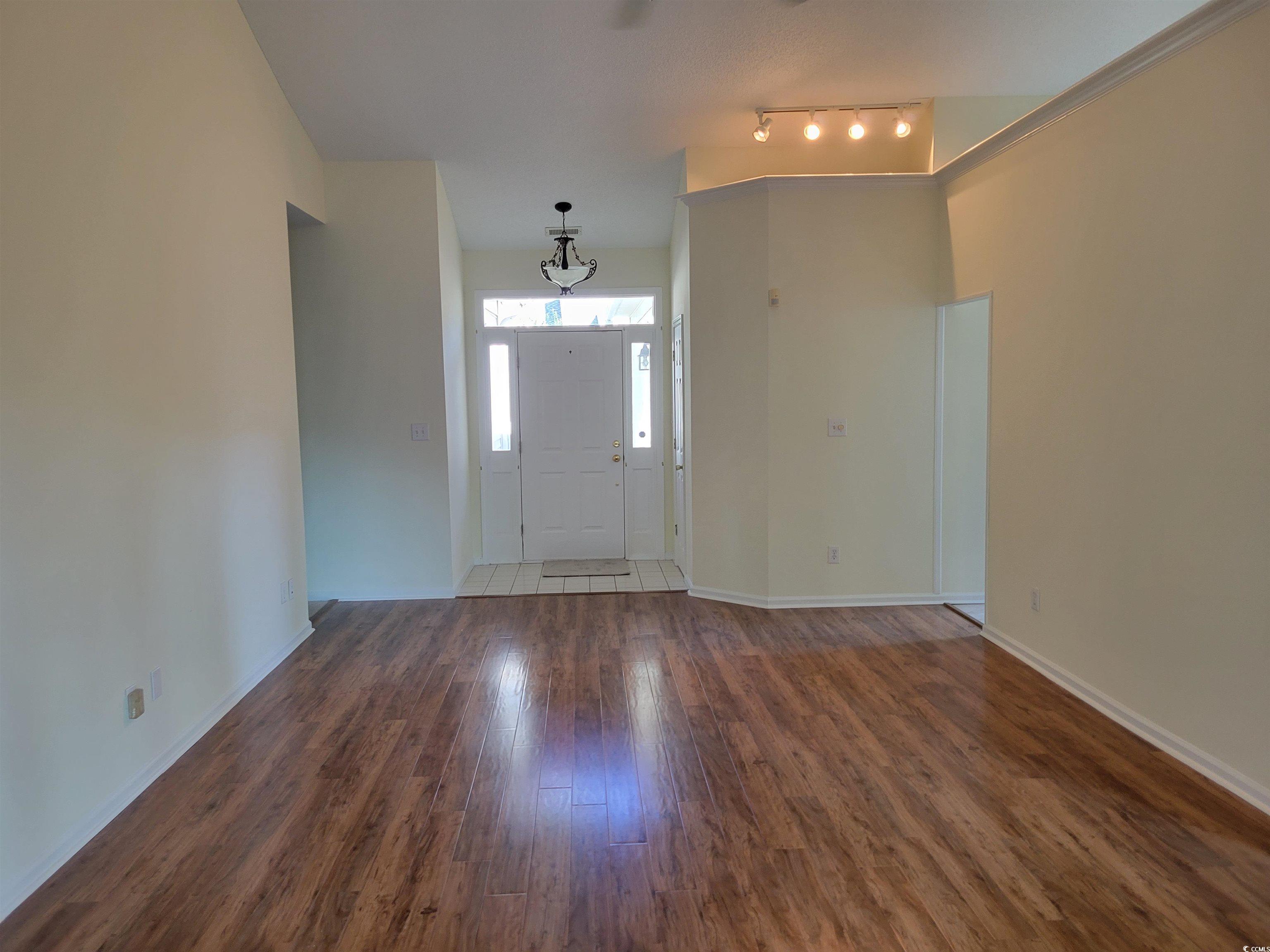 1481 Riceland Court Murrells Inlet, SC 29576 - Photo 9 of 30 Entryway featuring dark wood-type flooring and tra