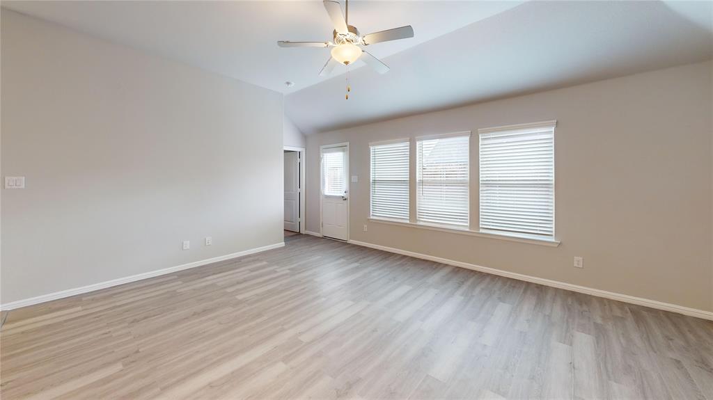 214 Crescent Avenue Melissa, TX 75454 - Photo 2 of 17 wooden floor in an empty room with a window
