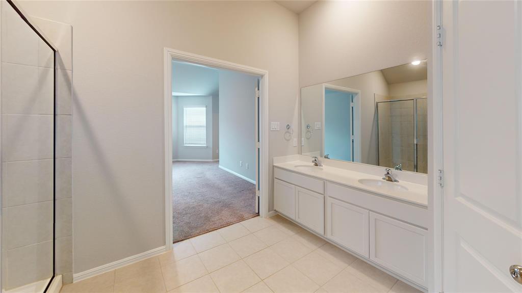 214 Crescent Avenue Melissa, TX 75454 - Photo 9 of 17 a bathroom with a double vanity sink and mirror