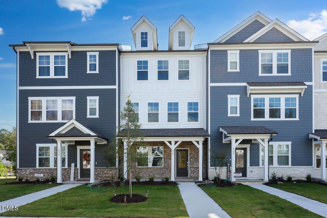 430 Rowe Way Knightdale, NC 27545 - Photo 1 of 51 a front view of a house with a yard