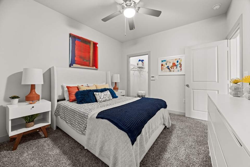 8800 South 1st Street, Unit 321 Austin, TX 78748 - Photo 4 of 20 a bedroom with a bed and a chandelier