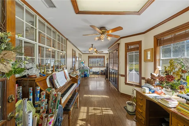 a kitchen with stainless steel appliances granite countertop wooden floors and sink