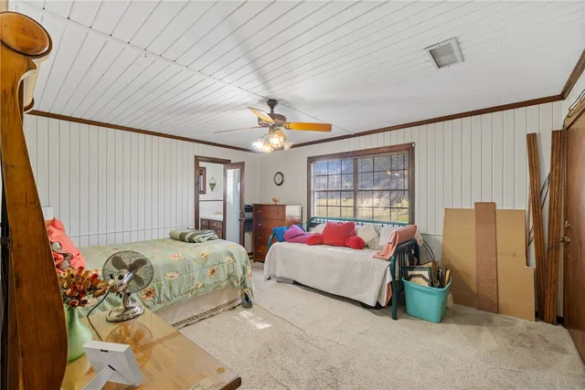 a spacious bathroom with a granite countertop sink mirror and bathtub