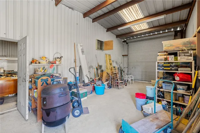 an aerial view of residential house with outdoor space and parking