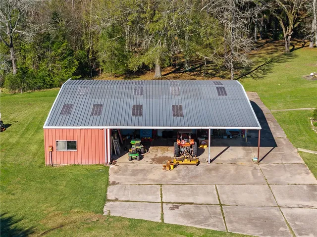 a view of a swimming pool with a yard