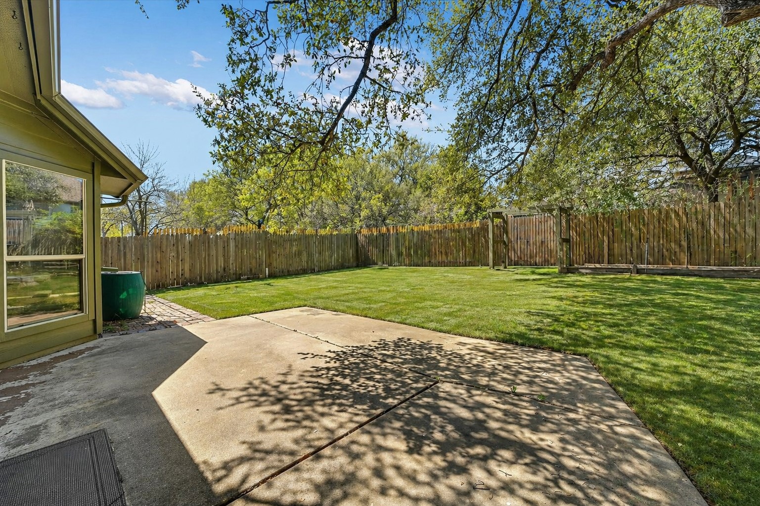 8024 Cobblestone Austin, TX 78735 - Photo 9 of 31 Reimagined backyard with beds removed and replaced with grass