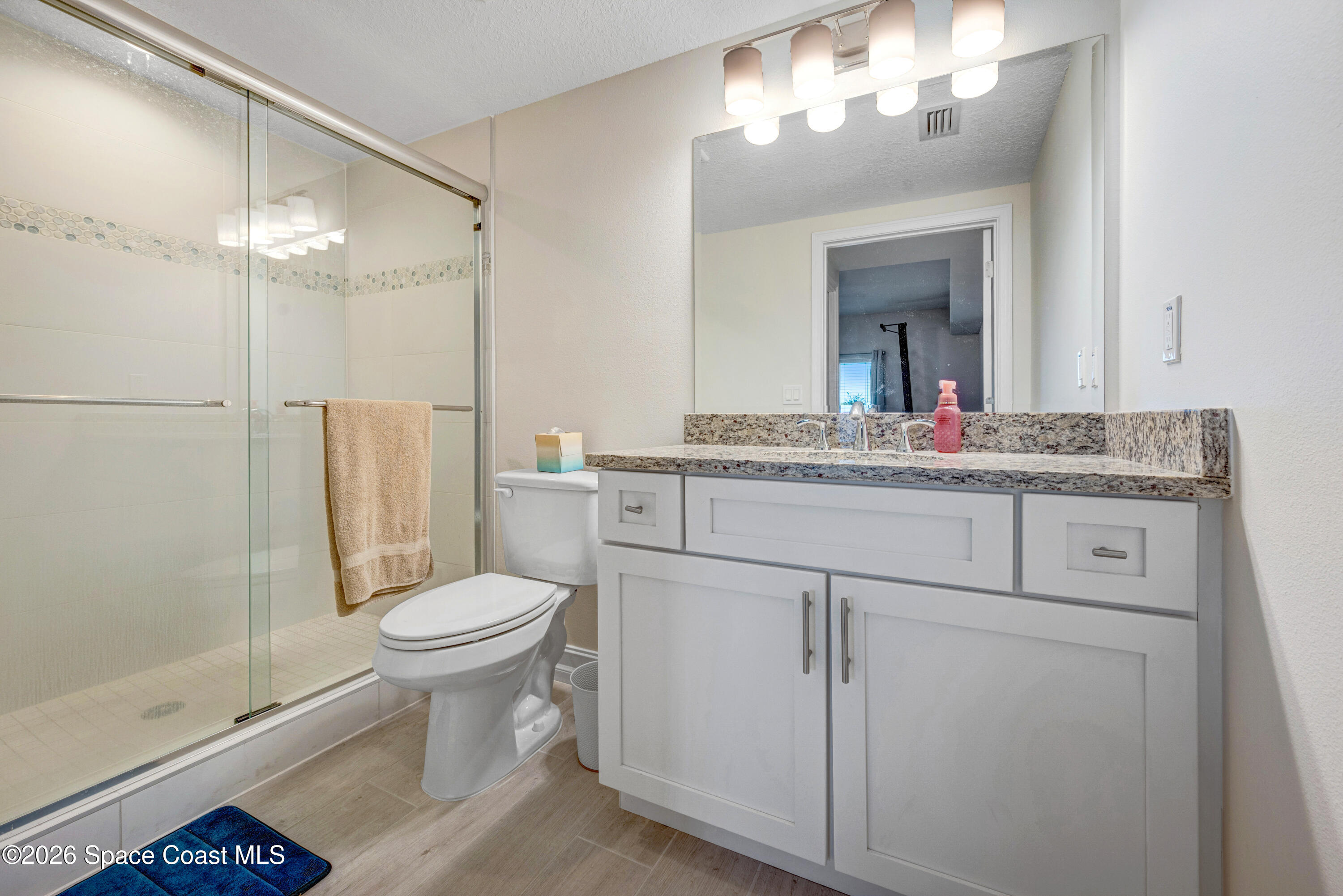 1825 Riverside Drive, Unit 204 Titusville, FL 32780 - Photo 18 of 29 a bathroom with a sink toilet and shower