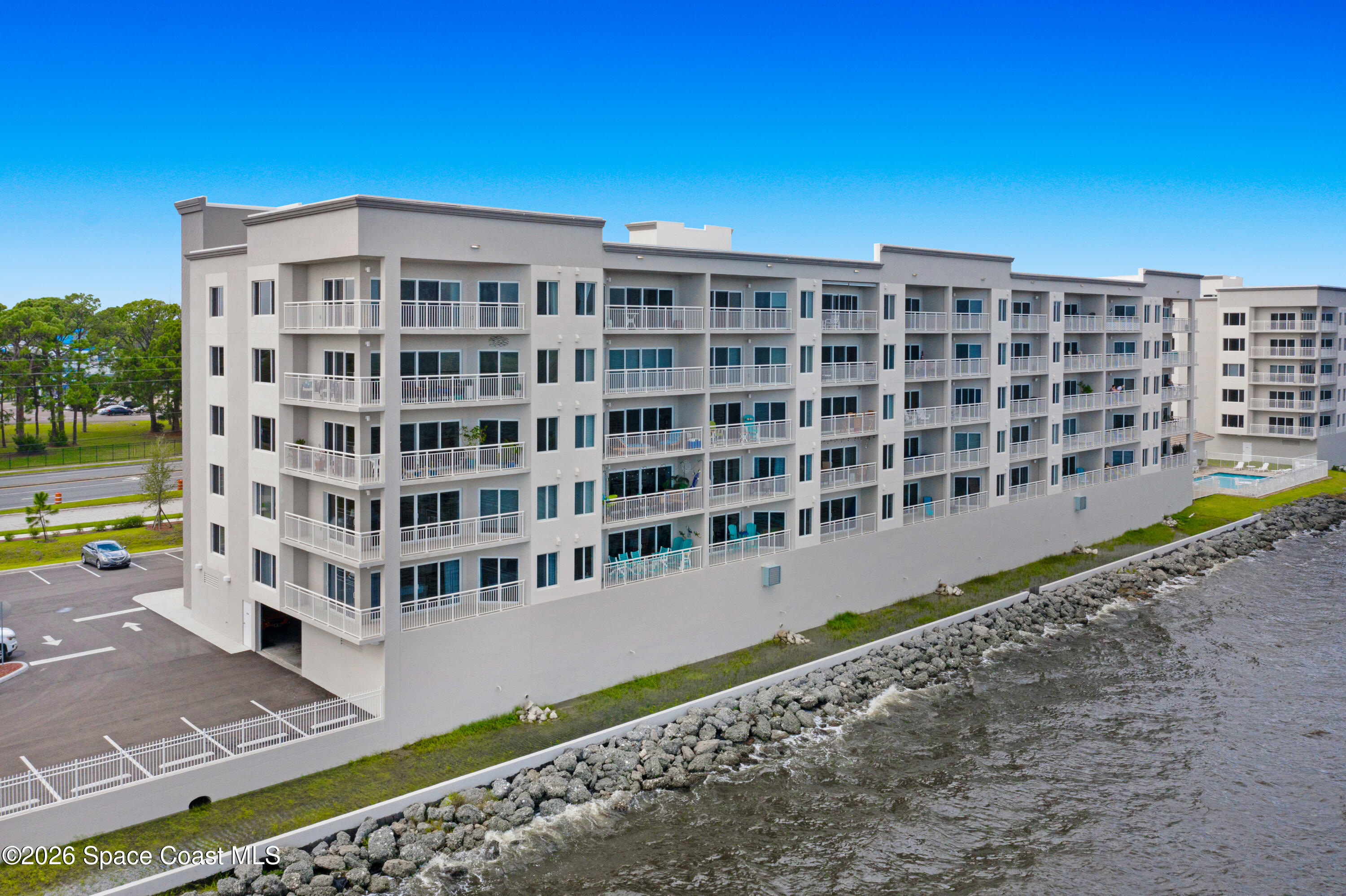 1825 Riverside Drive, Unit 204 Titusville, FL 32780 - Photo 2 of 29 a view of a building with a yard