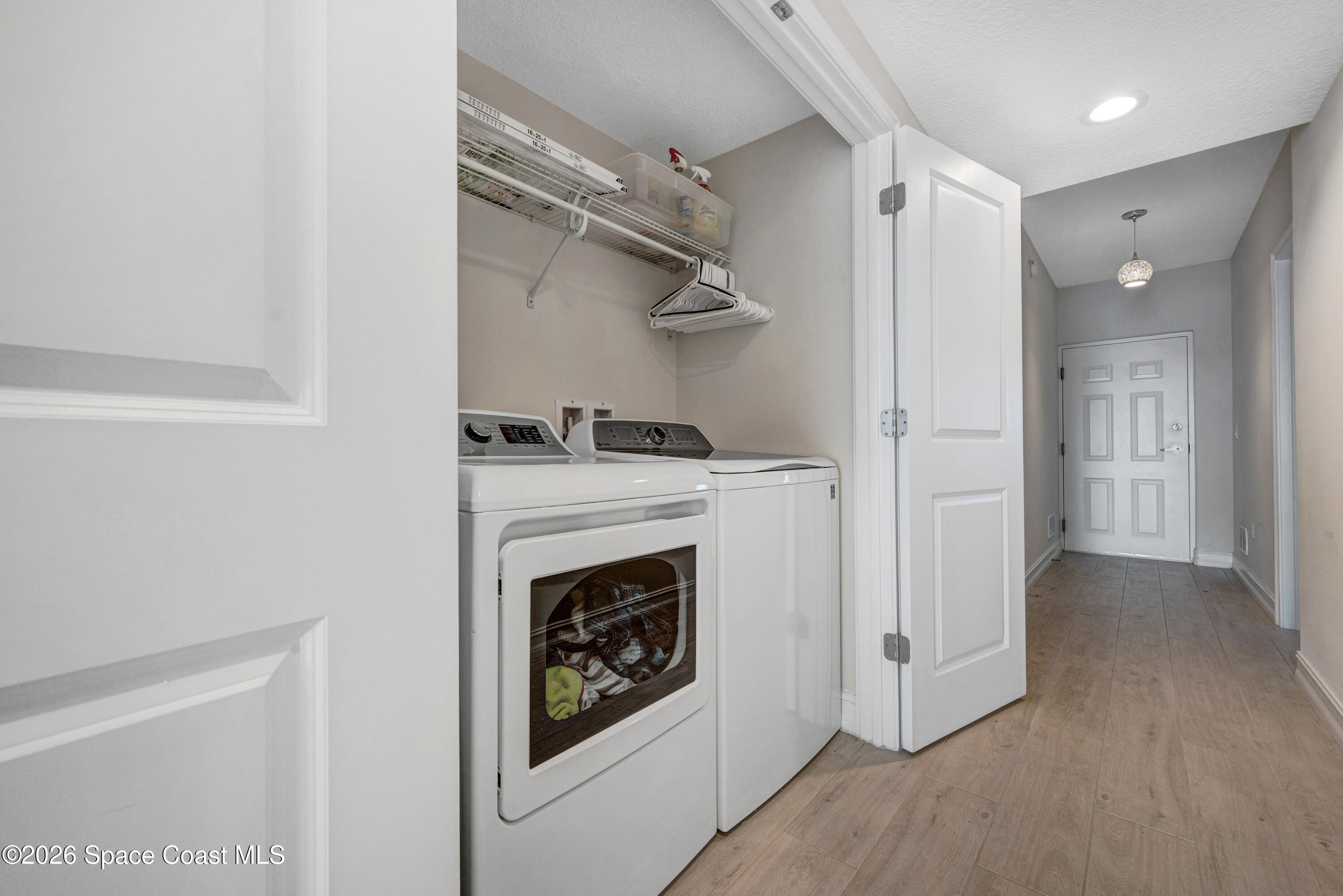 1825 Riverside Drive, Unit 204 Titusville, FL 32780 - Photo 21 of 29 a view of a livingroom with washer and dryer