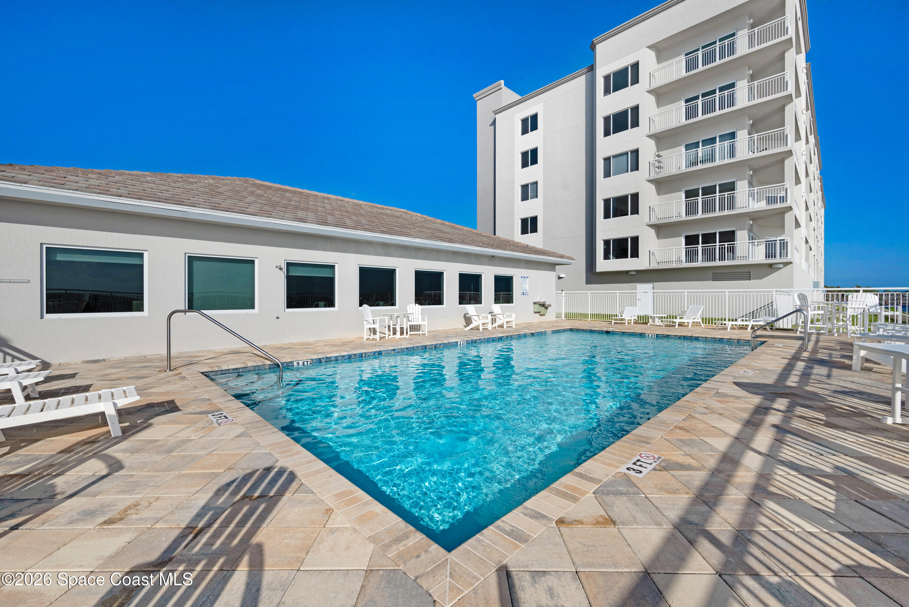 1825 Riverside Drive, Unit 204 Titusville, FL 32780 - Photo 23 of 29 a view of a house with swimming pool and sitting area