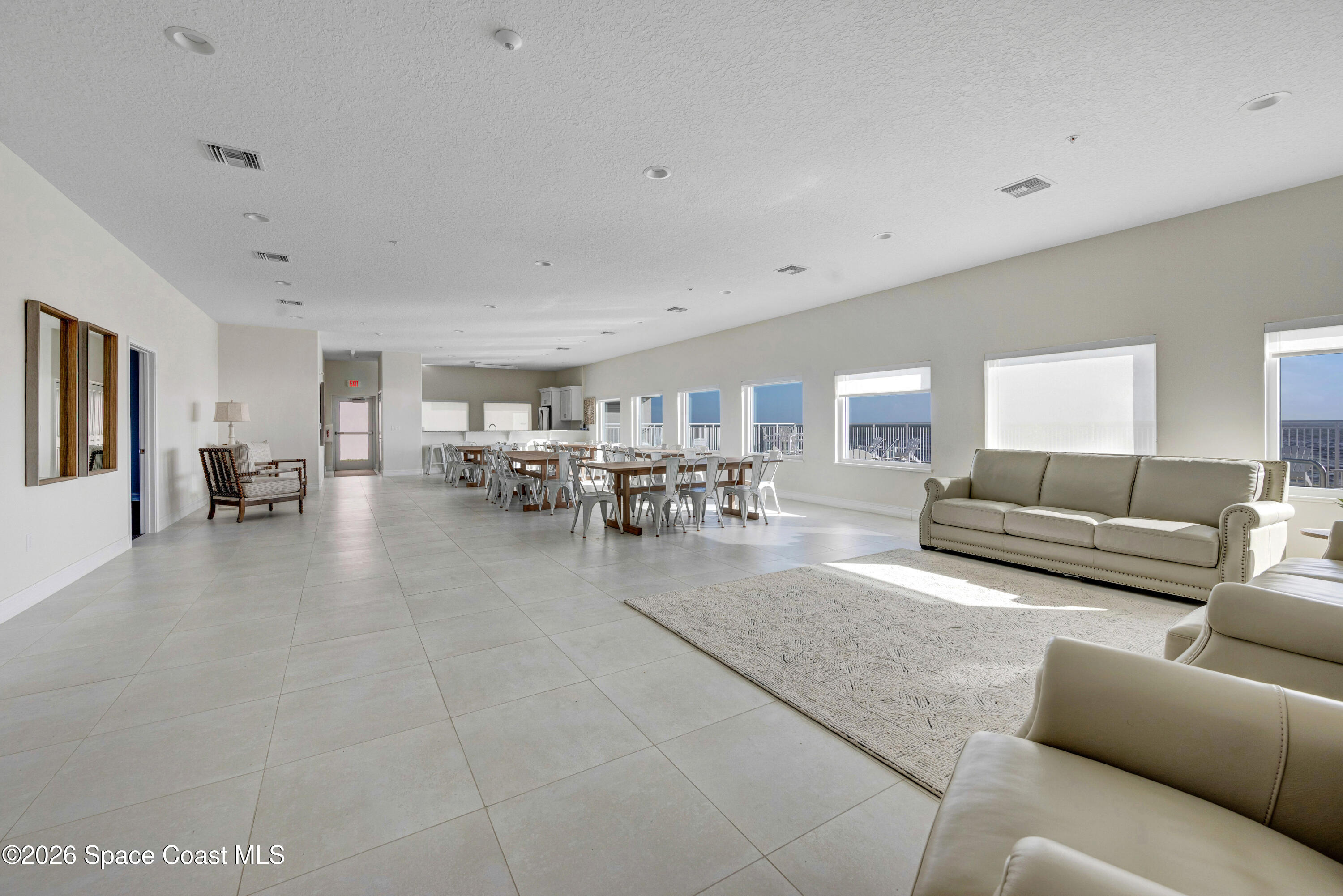1825 Riverside Drive, Unit 204 Titusville, FL 32780 - Photo 24 of 29 a living room with furniture and a table