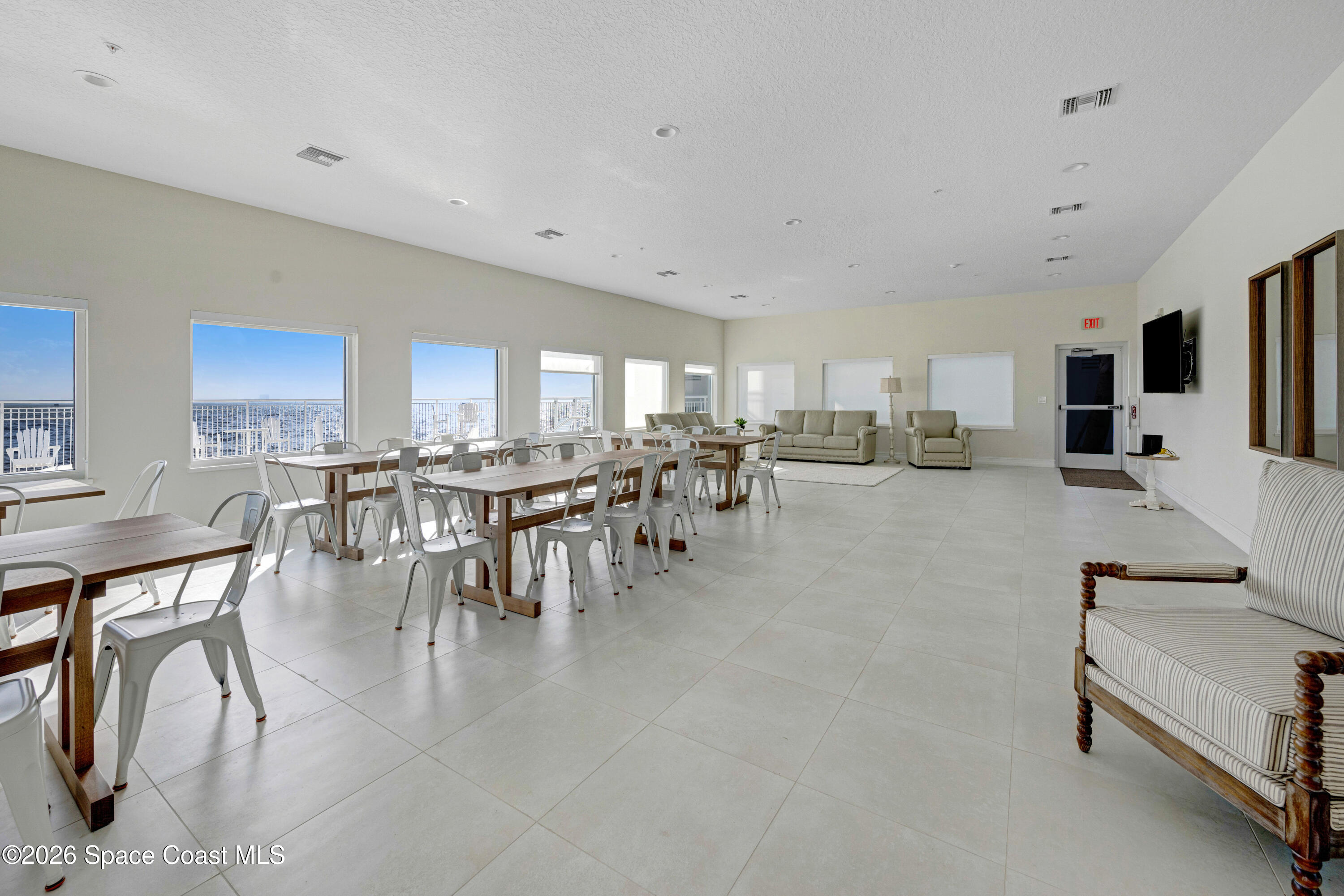 1825 Riverside Drive, Unit 204 Titusville, FL 32780 - Photo 25 of 29 a group of people sitting in a living room