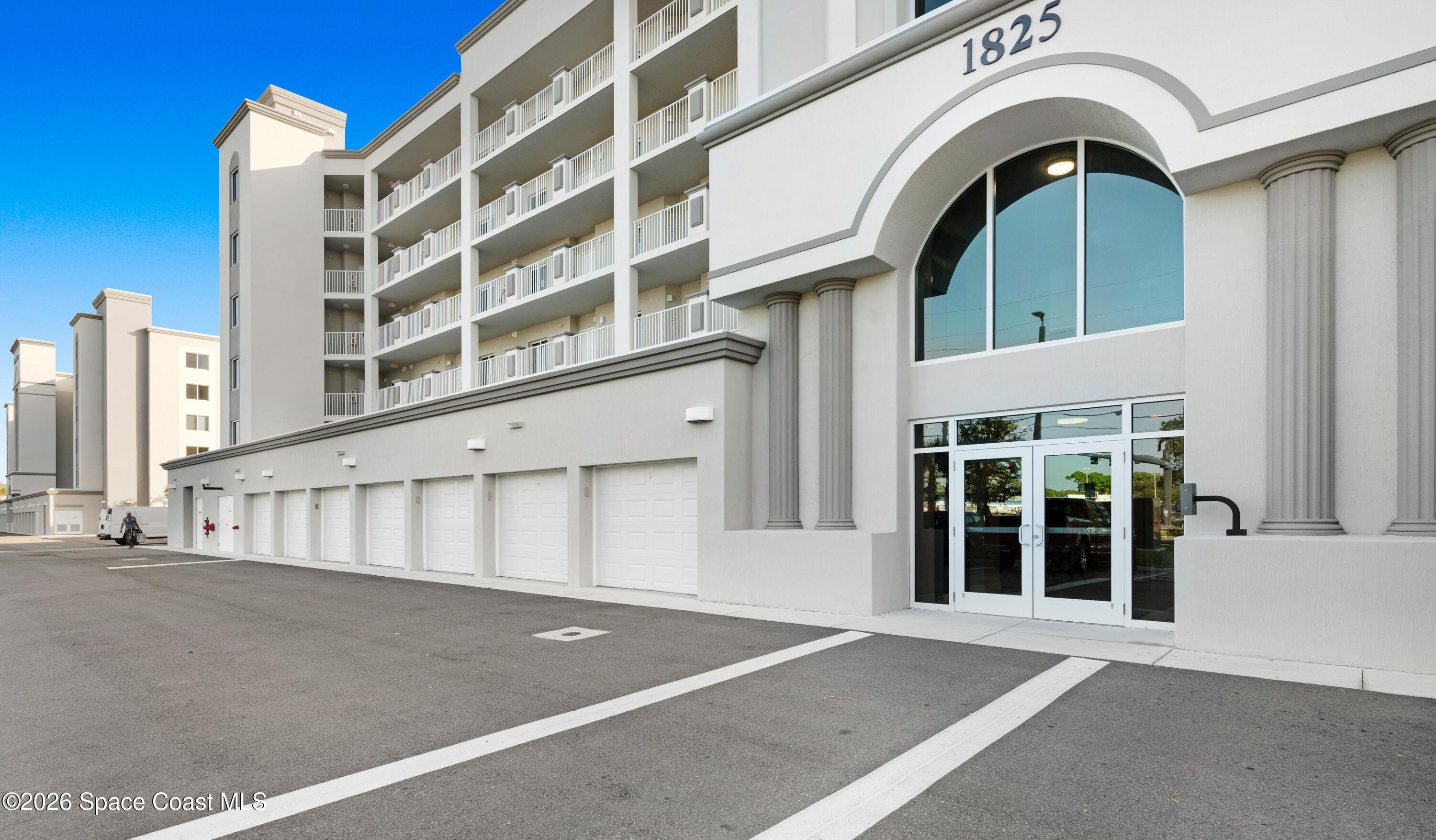 1825 Riverside Drive, Unit 204 Titusville, FL 32780 - Photo 3 of 29 a view of a large building with a door