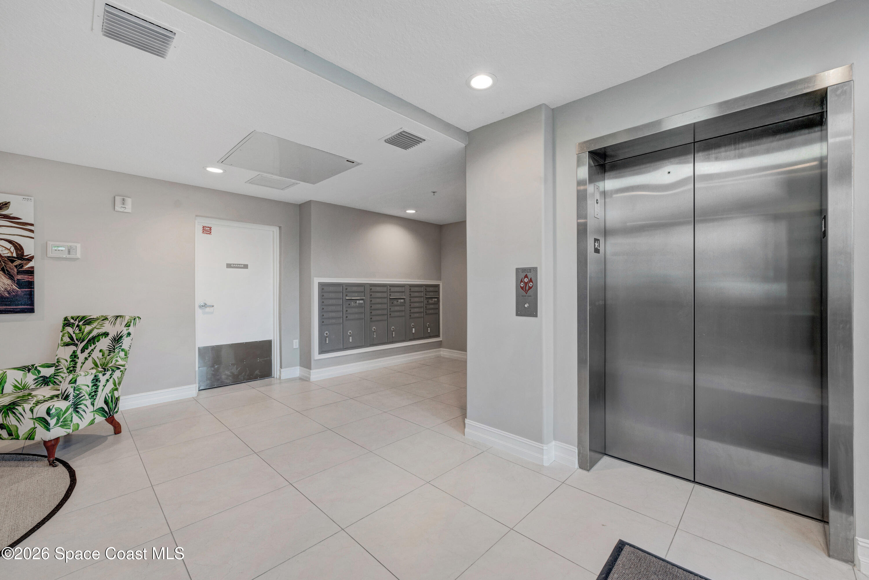 1825 Riverside Drive, Unit 204 Titusville, FL 32780 - Photo 5 of 29 a view of kitchen with refrigerator furniture and natural light
