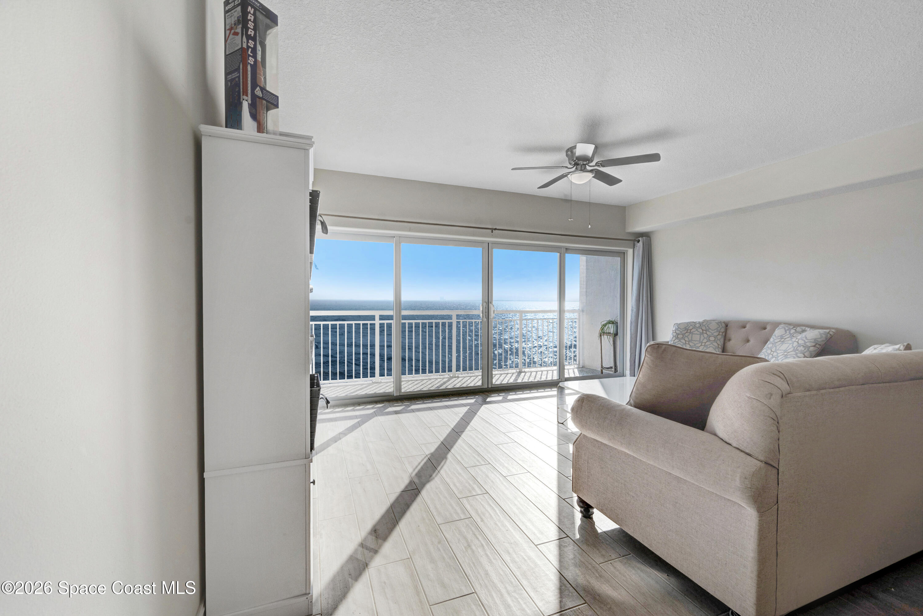 1825 Riverside Drive, Unit 204 Titusville, FL 32780 - Photo 7 of 29 a living room with furniture and a large window