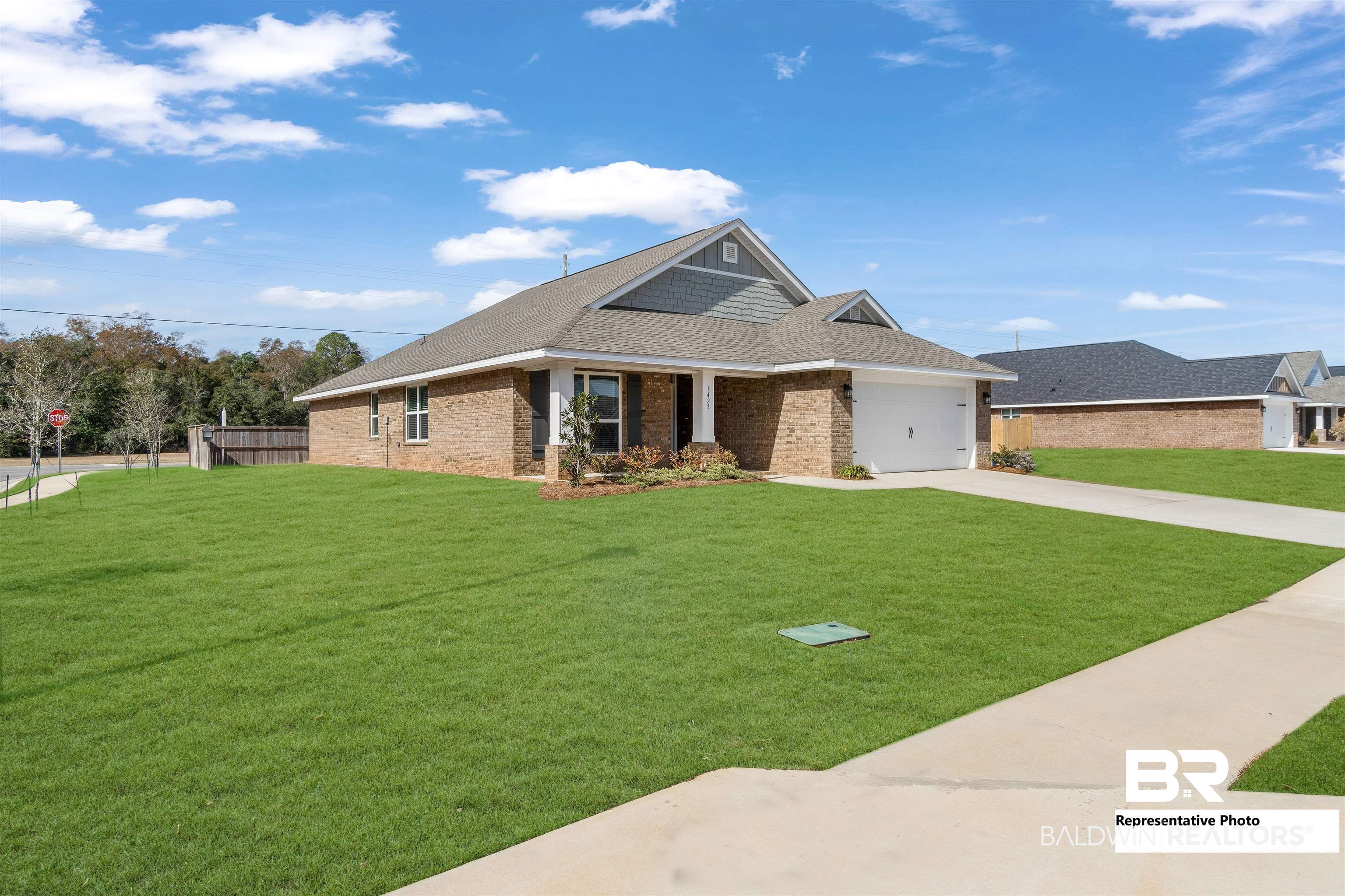 660 Mayflower Drive Foley, AL 36535 - Photo 36 of 36 View of front facade featuring a garage and a front lawn