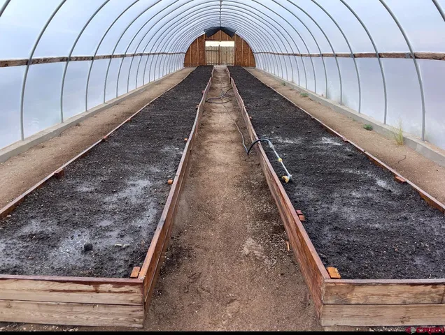 a view of roof deck with furniture and a grill