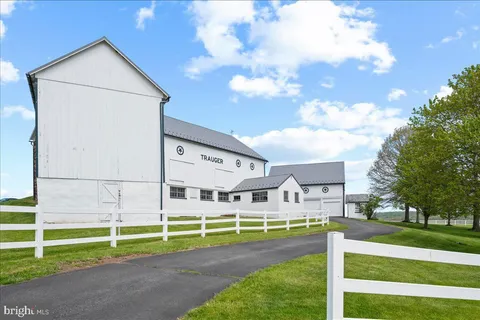 a view of house with backyard