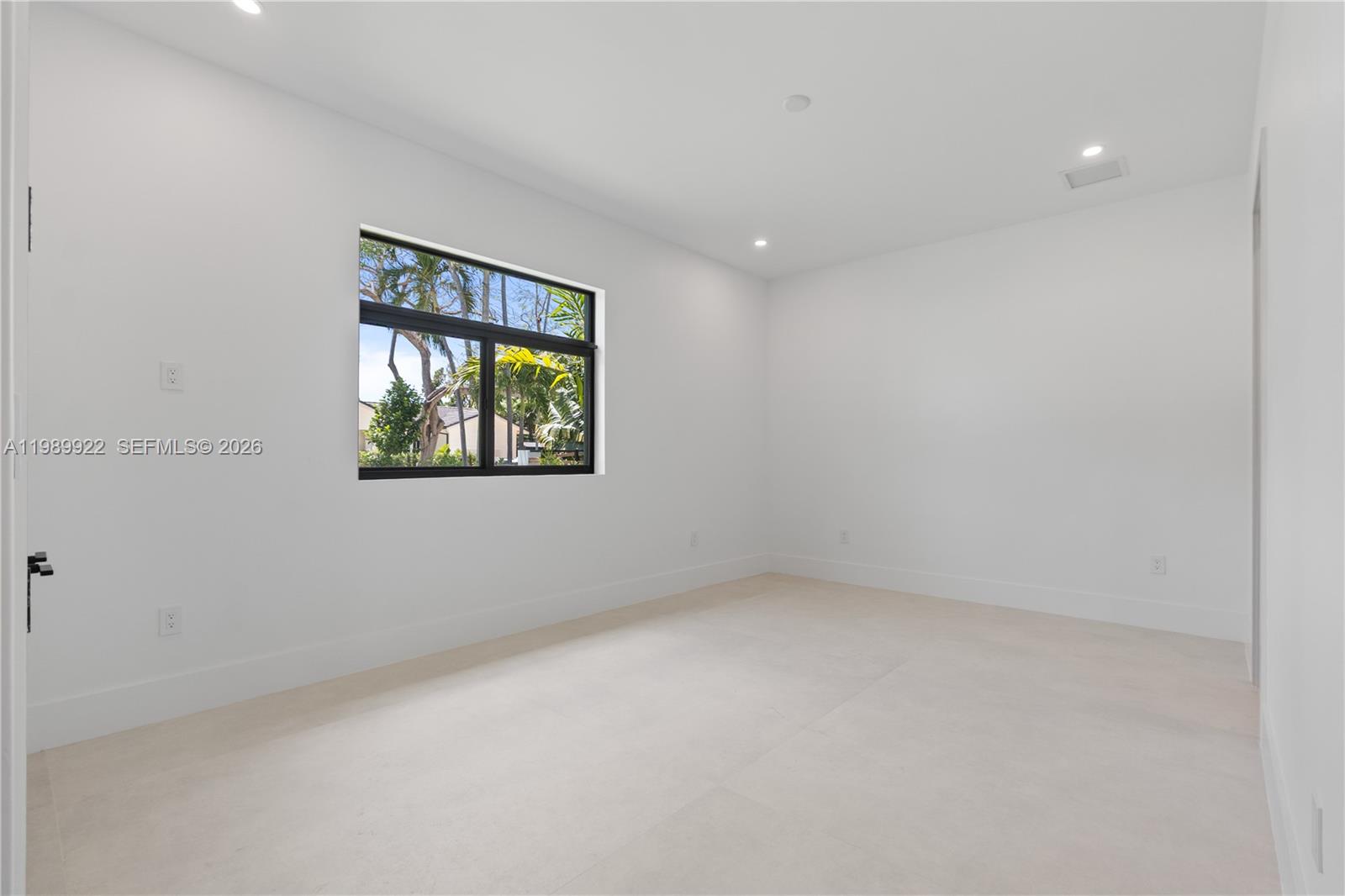6221 Southwest 60th Street South Miami, FL 33143 - Photo 22 of 42 an empty room with a window