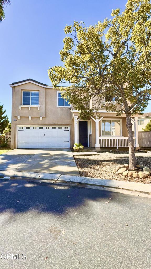 a view of a house with a snow on the side of the road