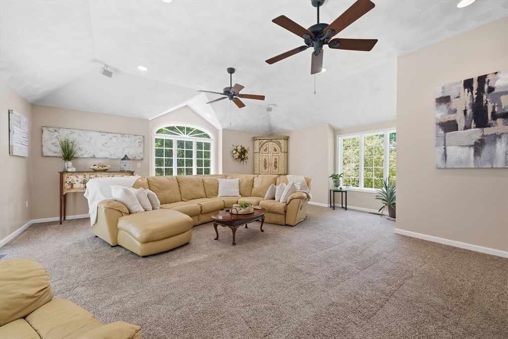 25 Haymeadow Road Boxford, MA 01921 - Photo 19 of 42 a living room with furniture ceiling fan and a window
