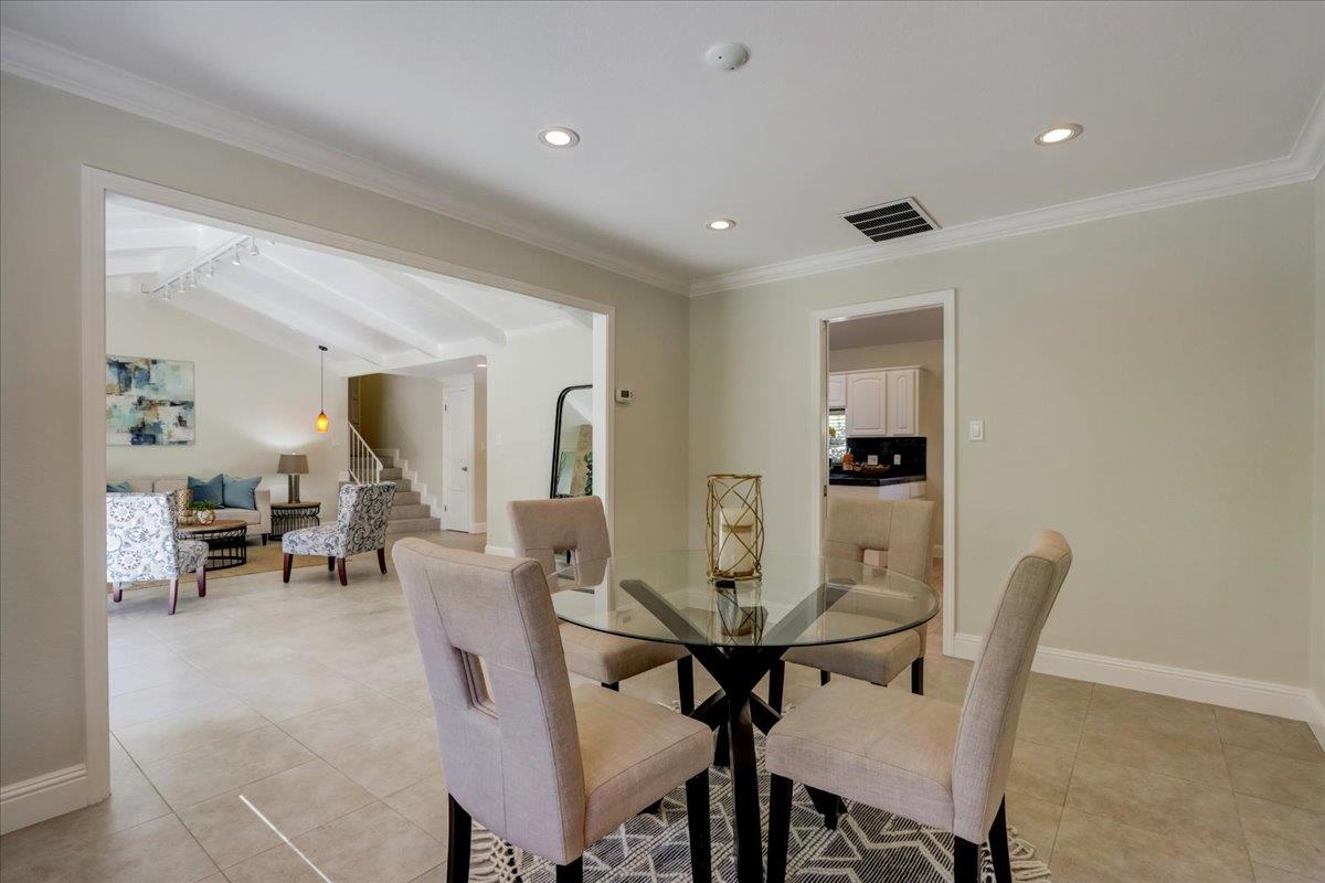 1276 Echo Valley Drive San Jose, CA 95120 - Photo 15 of 54 a view of a dining room with furniture and a potted plant