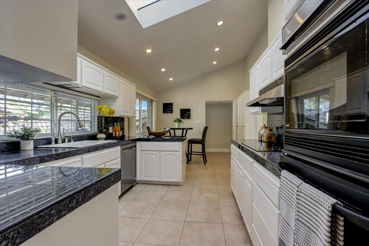 1276 Echo Valley Drive San Jose, CA 95120 - Photo 16 of 54 a large kitchen with a large counter top appliances and cabinets