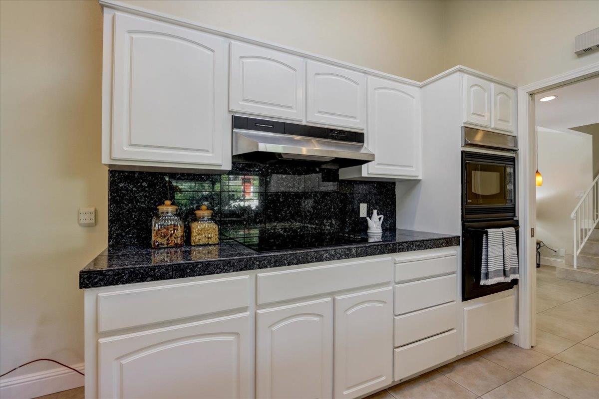 1276 Echo Valley Drive San Jose, CA 95120 - Photo 19 of 54 a kitchen with stainless steel appliances granite countertop a sink a stove and cabinets