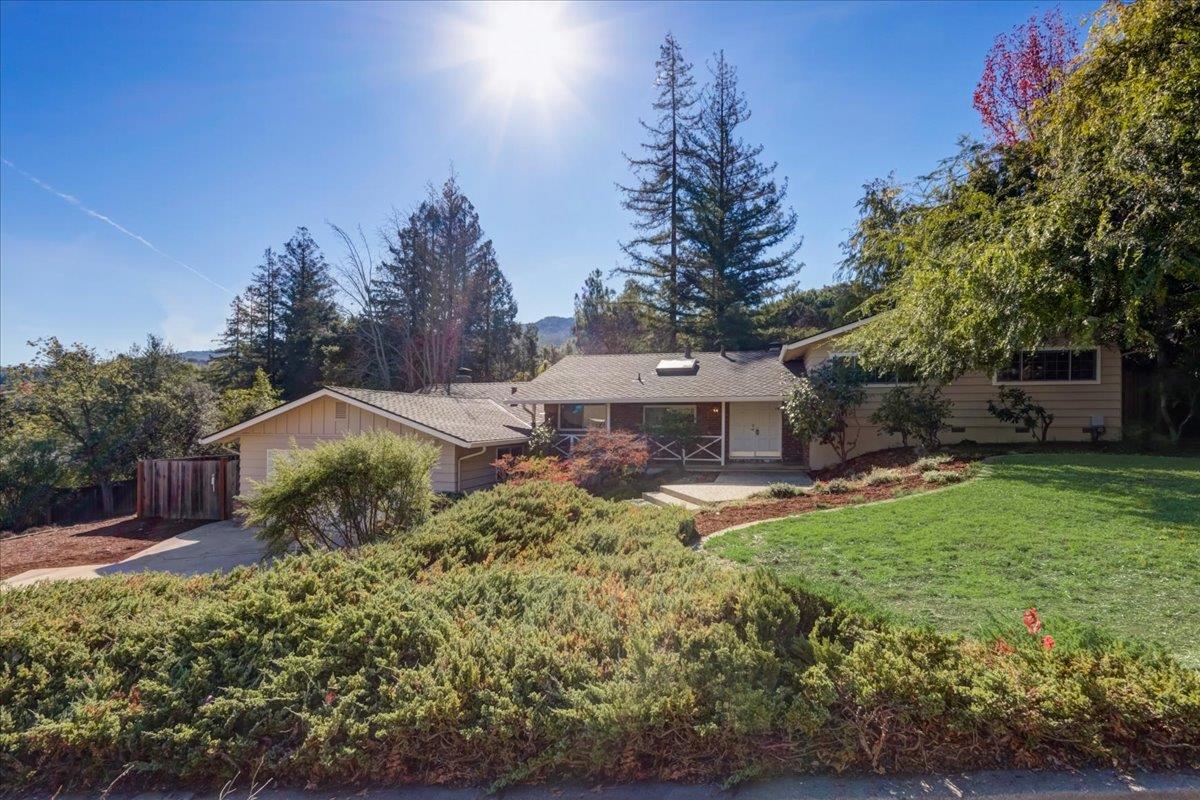 1276 Echo Valley Drive San Jose, CA 95120 - Photo 3 of 54 a view of a house with a yard and a garden