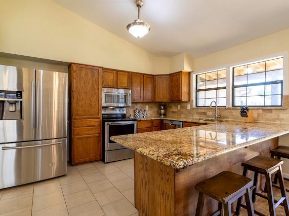8209 Woodside Road Rowlett, TX 75088 - Photo 14 of 30 Granite counter tops and bar stool seating