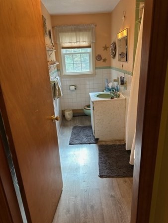 66 Birch Meadow Road Merrimac, MA 01860 - Photo 12 of 19 a bathroom with a sink and a mirror
