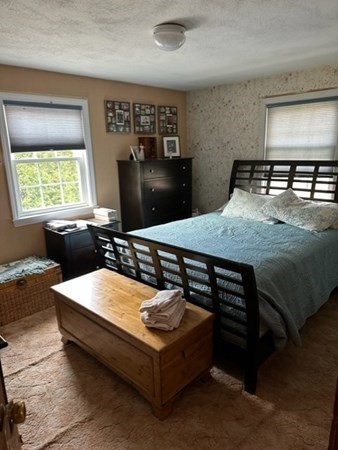 66 Birch Meadow Road Merrimac, MA 01860 - Photo 13 of 19 a bed sitting in a room next to a window