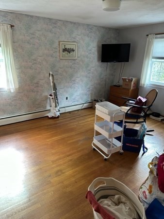 66 Birch Meadow Road Merrimac, MA 01860 - Photo 14 of 19 a room with gym equipment and a flat screen tv