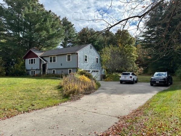 66 Birch Meadow Road Merrimac, MA 01860 - Photo 3 of 19 a house view with a garden space