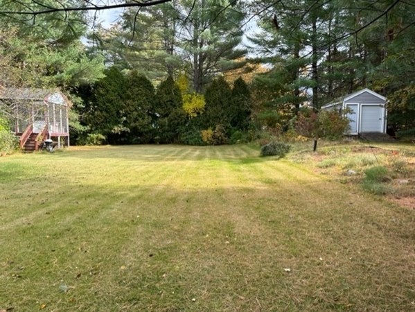 66 Birch Meadow Road Merrimac, MA 01860 - Photo 6 of 19 a view of a yard with a house and large trees