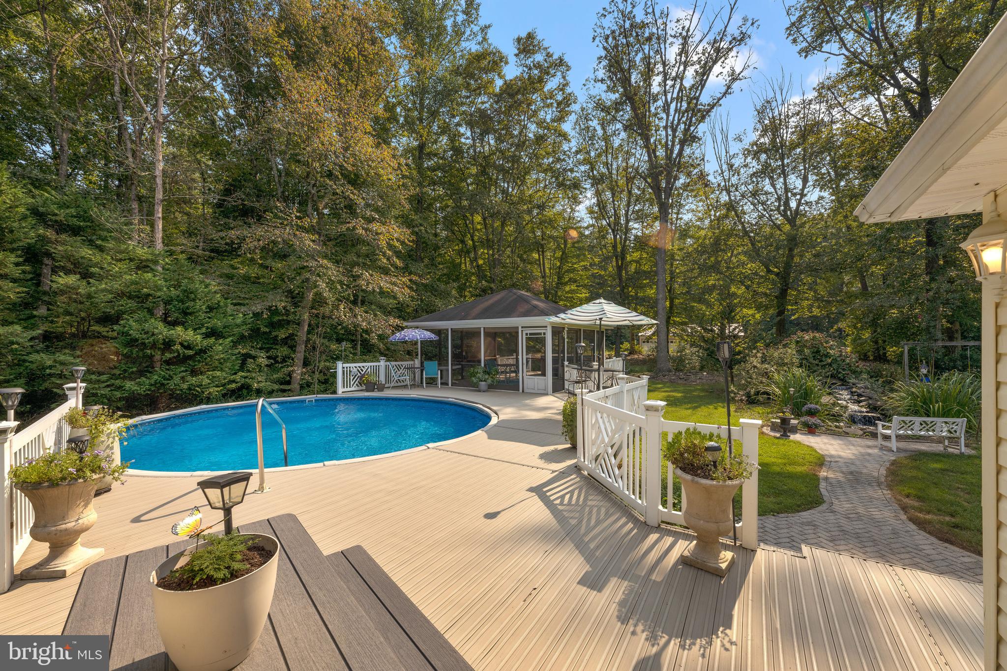 2647 Evergreen Road Odenton, MD 21054 - Photo 44 of 57 Vinyl Deck and Pool with Screened Porch