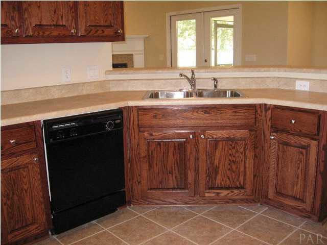 32748 Arbor Ridge Circle Lillian, AL 36549 - Photo 7 of 11 Open kitchen to breakfast area, door from Formal Dining and easy access to laundry room.