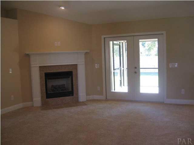 32748 Arbor Ridge Circle Lillian, AL 36549 - Photo 8 of 11 gas log fireplace, french doors to large screened porch