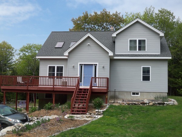 32 Ferin Road Ashburnham, MA 01430 - Photo 4 of 29 a front view of a house with a yard and garage