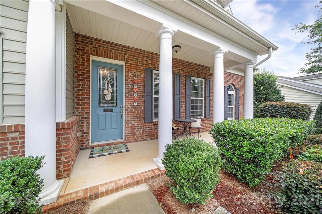 324 Miners Cove Way Fort Mill, SC 29708 - Photo 2 of 48 front view of the house with a yard