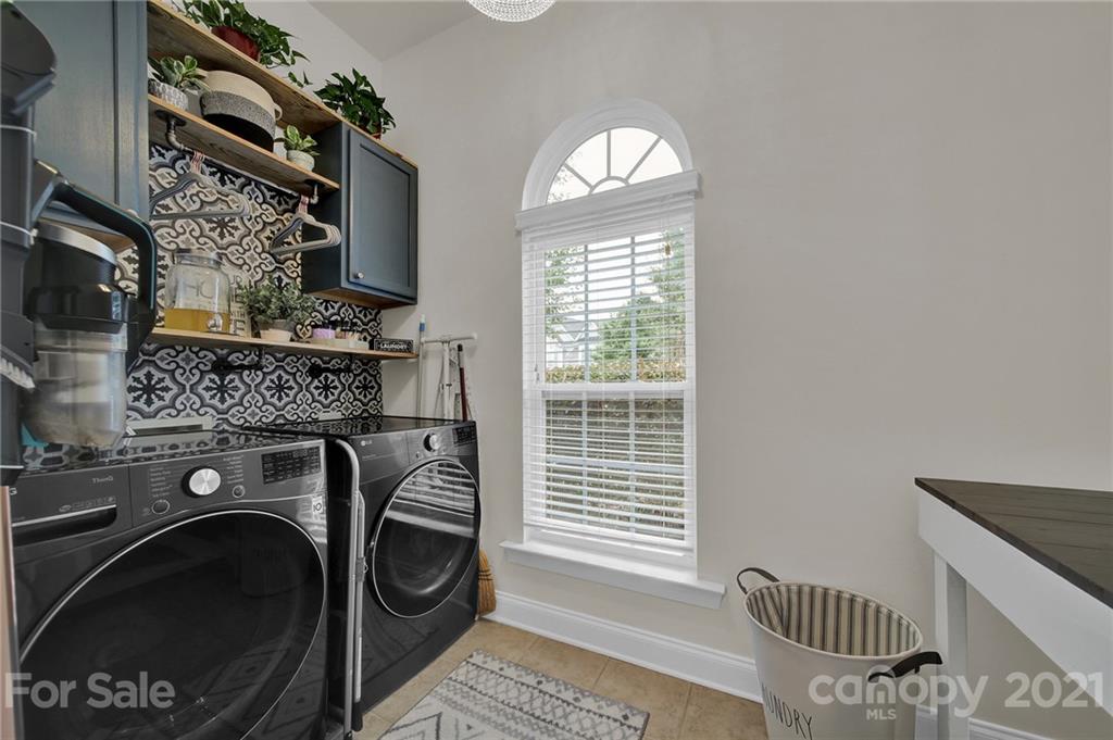 324 Miners Cove Way Fort Mill, SC 29708 - Photo 17 of 48 a view of a livingroom with washer and dryer