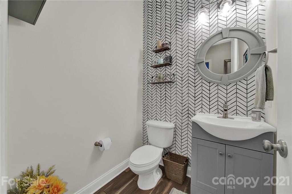 324 Miners Cove Way Fort Mill, SC 29708 - Photo 18 of 48 a bathroom with a sink toilet and a mirror