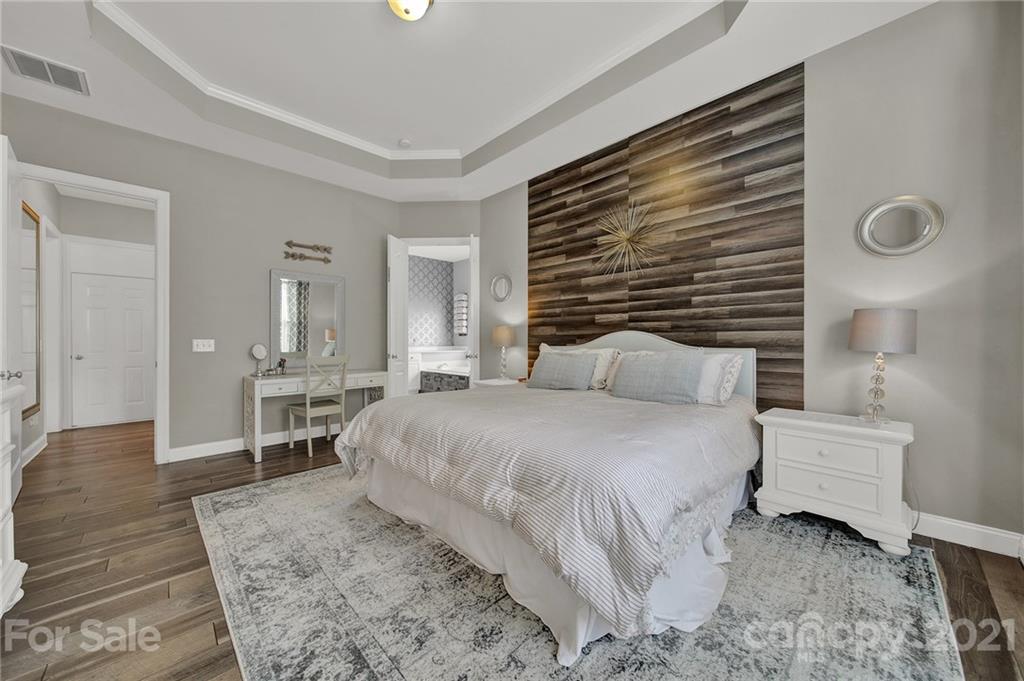 324 Miners Cove Way Fort Mill, SC 29708 - Photo 20 of 48 a bedroom with a bed and a table