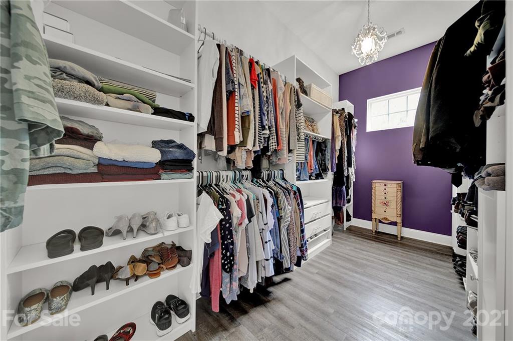 324 Miners Cove Way Fort Mill, SC 29708 - Photo 24 of 48 a view of walk in closet with clothes and shoes